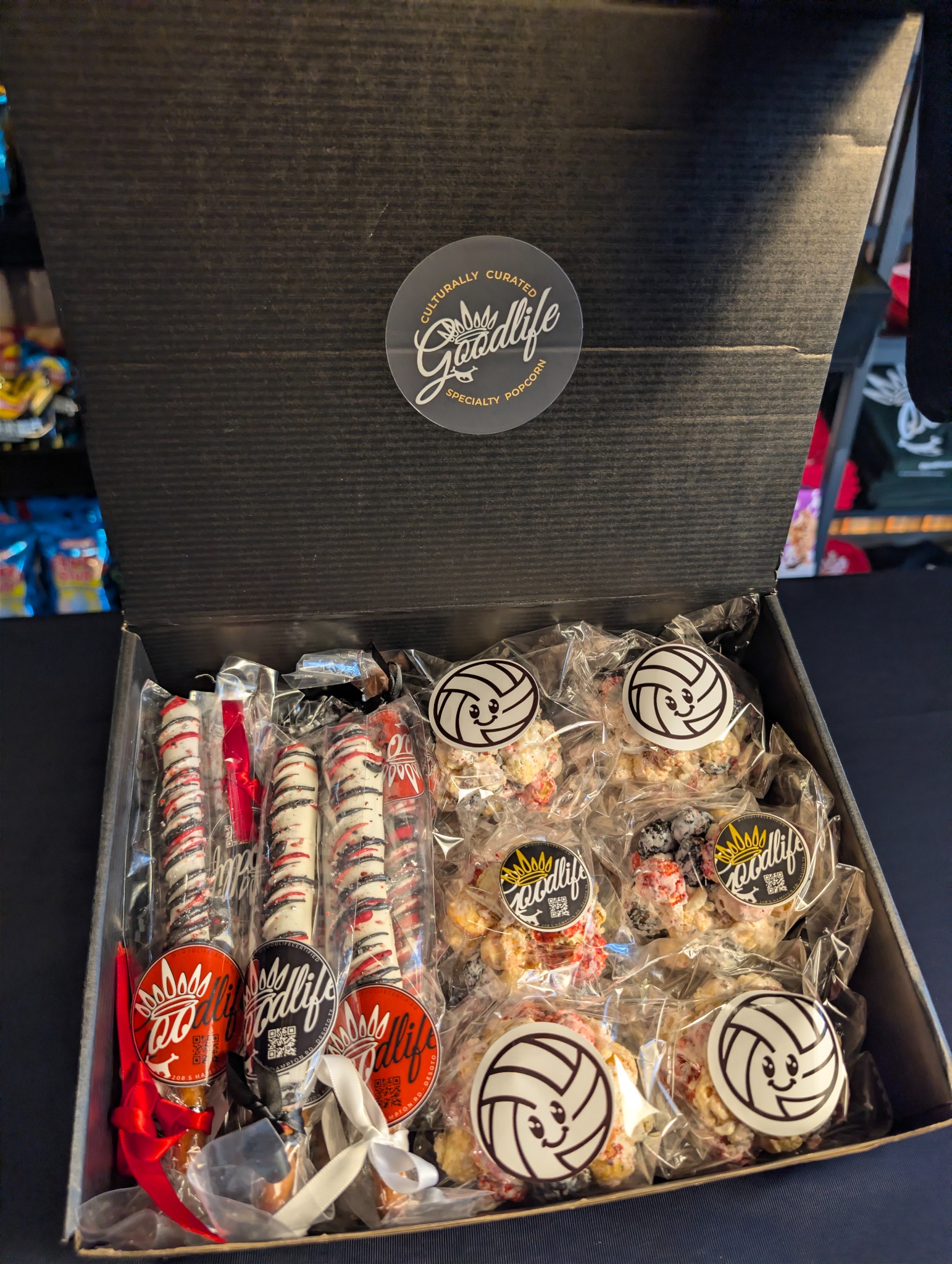Goodlife Treats collection with popcorn balls and decorated pretzel rods